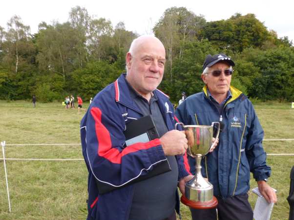 Tim Richardson receives the Popplewell Trophy from League Chairman Ken Littlejohns